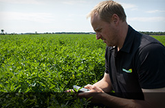 James Parsons in the field with the farming app Field Tracker Pro.